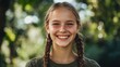 © Sanych - Teenaged German girl with braids and a cheerful grin.
