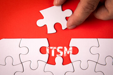 Sticker - itsm - information technology service management. white puzzle pieces on an red background
