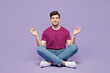 © ViDi Studio - Full body young man he wear violet t-shirt casual clothes sit hold spreading hands in yoga om aum gesture relax meditate try to calm down isolated on plain pastel purple background. Lifestyle concept.