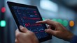 © Chopang.studio - A person interacts with a tablet displaying data visualizations and graphs, set against a background of glowing control panel lights.