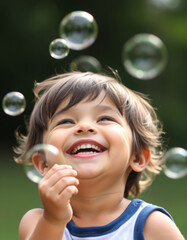 portrait of a joyful child playing with soap bubbles, Joyful happy laughing African American child daughter kid girl children laugh excited open mouth amazed enjoy playing with soap bubbles having fun