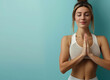© Svitlana - Female yoga. Cute fit girl in sportswear practicing yoga at turquoise studio. Meditation, relax wellness concept. Workout.Generative ai