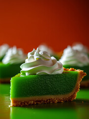 Lime pie slice with whipped cream topping.