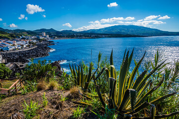 Wall Mural - A view from the lookout for the Dog Face islet down the coastline of the island of San Miguel in the Azores in summertime