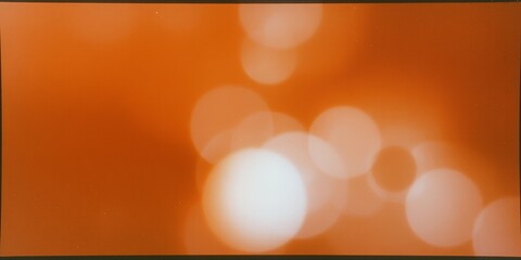 Canvas Print - Abstract bokeh background with warm orange tones.