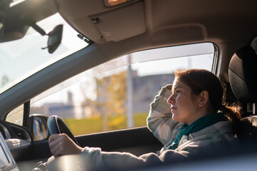 Portrait of a pensive Caucasian woman driving. 