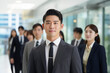 © PulseImages - Young Asian Businessman Leading Team in a Modern Office Environment