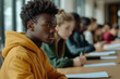 © Varitnan - A group of students are sitting at a table with books and papers