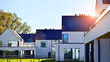 © Grand Warszawski - New elegant modern single family house. Terraced family homes in newly developed housing estate. Facade of a modern house with white walls. Real estate concept, european style.