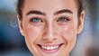 © Tom - Close-up of a young Caucasian woman with blue eyes and a radiant smile, showcasing her natural beauty and flawless skin, highlighting her vibrant expression.