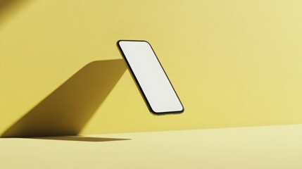 Aufkleber - A contemporary smartphone appears to float in mid-air, casting a sharp shadow on a bright yellow surface, highlighting its sleek design and minimalistic aesthetics in an open space.