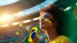 © Margarita Ratatosk - Happy young girl football fan celebrating her team victory. Latino woman with Brazil flag laughing and smiling. Celebration of Independence Day, Labor Day, Proclamation of the Republic