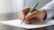 © Tekin - Hand With Pen Over Blank Form
