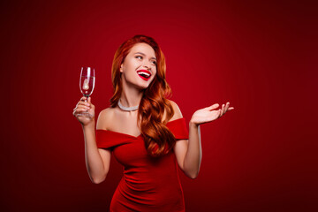 photo of attractive chic girl feel excited raise christmas glass champagne look red empty space back