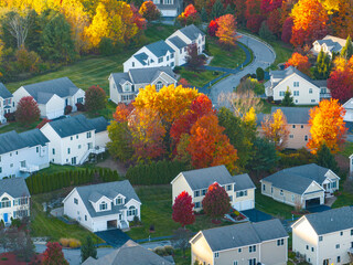 Poster - Aerial view of suburban housing community in autumn season with colorful trees