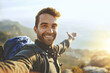 © peopleimages.com - Man, selfie and mountain with portrait outdoor for fitness adventure, photography and social media post. Hiker, profile picture and trekking with hiking memory, nature blog and travel journey of trip