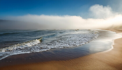 Foggy beach with water washing onshore, bright sunshine