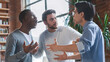 © Prostock-studio - Office conflict concept. Emotional young multiracial men arguing at office