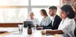 © Prostock-studio - Corporate Lifestyle. Group Of Business People Having Meeting Working Together Sitting At One Desk In Modern Office. Selective Focus, Panorama