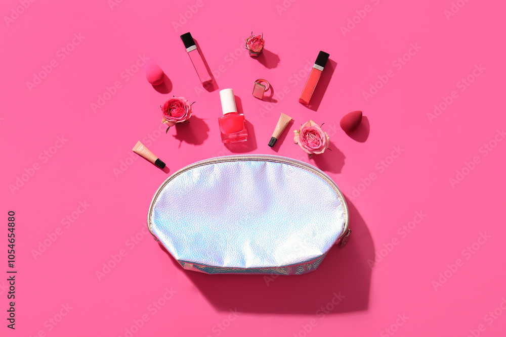Composition with bag, decorative cosmetics, makeup sponges and flowers on pink background