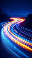 Poster - Colorful light trails streak across a winding road at night, creating a sense of speed and movement.