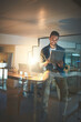 © peopleimages.com - Night, business and happy man on tablet in office for research project, online website and internet. Professional, company and worker on digital tech working late for planning, networking and email