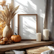 © Maya - cozy home interior with frame mockup, autumn fall decorations, pumpkins, vase of wheat, candle. scandi, minimal style. poster design for halloween or thanksgiving with white shades, isome