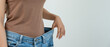 © Shisu_ka - Women showing results of diet. Beautiful shape. female have a reduced waist size after under going a weight loss corse. can not wear jeans due to weight loss. balance, control, routines, exercise.