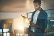 © peopleimages.com - Tablet, office and business man at night for research, online website and information technology. Startup, company and worker on digital tech working late for planning, web design and ux software