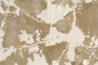 © Tammy Walker - Close-up of a weathered concrete wall with peeling white paint abstract textured background