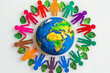 © mankjon - Colorful Representation of Global Unity and Environmental Awareness Featuring People Cutouts Surrounding Earth