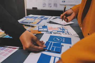 The designer team is designing the uxui system to make the uxui system work well on new phones and support system updates. Website development concept UI UX front end designer