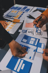 Wall Mural - the designer team is designing the uxui system to make the uxui system work well on new phones and s