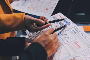 The designer team is designing the uxui system to make the uxui system work well on new phones and support system updates. Website development concept UI UX front end designer
