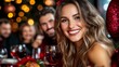 © Raul - A woman smiles brightly while celebrating the holidays with friends. She is holding a glass of wine and wearing a festive red headband.