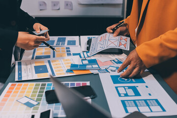 The designer team is designing the uxui system to make the uxui system work well on new phones and support system updates. Website development concept UI UX front end designer