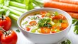 © peerawat - A nutritious vegetable soup recipe, featuring carrots, celery, and tomatoes in a savory broth, isolated on a white background