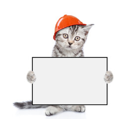 Poster - Cute kitten wearing hardhat holds blank white banner. isolated on white background