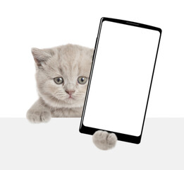 Aufkleber - Cute cat looks above blank white banner and shows big smartphone with blank screen. isolated on white background