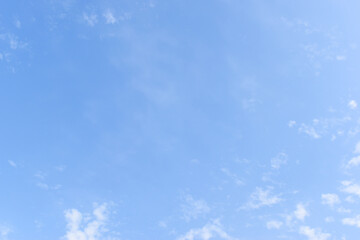 Wall Mural - beautiful blue sky and white fluffy group of clouds with sunrise in the morning, natural background
