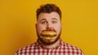 © Intelligent Horizons - Close up portrait of a bearded man with a satisfied  content expression on his face as he indulges in a mouthwatering burger against a vibrant yellow background