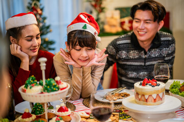 Wall Mural - Asian lovely family celebrating Christmas party together in house. 