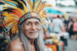© Vasili - Portrait of a cheerful elderly man wearing a vibrant traditional headdress, smiling warmly. His expression and attire reflect cultural pride and a joyful spirit.
