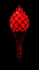 Wall Mural - A red glowing torch with a woven design on a black background.