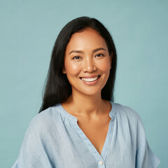 Asia woman with a happy expression, wearing a light blue blouse