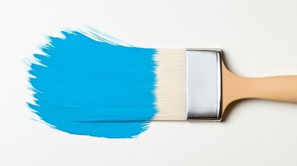 Paintbrush painting a bright blue stroke on white background