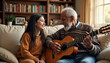 © irissca - A senior man joyfully plays the guitar while sitting with a young woman in a cozy living room filled with books and warm sunlight during a relaxed afternoon
