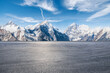 © ABCDstock - Asphalt road square and snow mountain natural landscape under blue sky. car background.