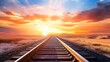 © Koh's Smart - A mesmerizing stock photo of a train track stretching into the horizon of a desert landscape at sunset, with vibrant hues of orange and pink illuminating the sky in the background.