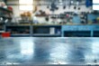 © Kiran - Industrial Metal Tabletop with Blurred Tools Background